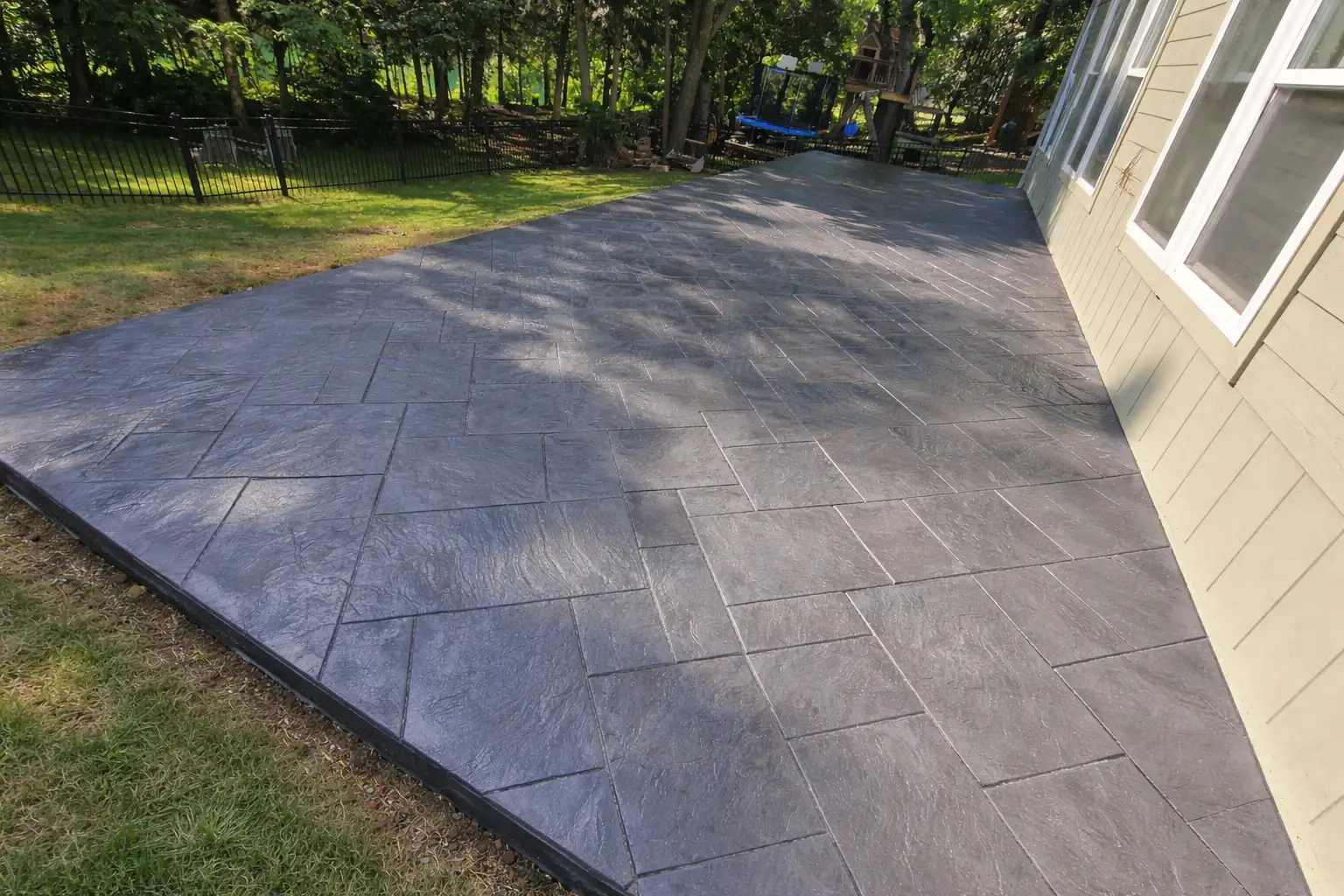 Stamped concrete patio with ashlar slate pattern — Kansas City metro
